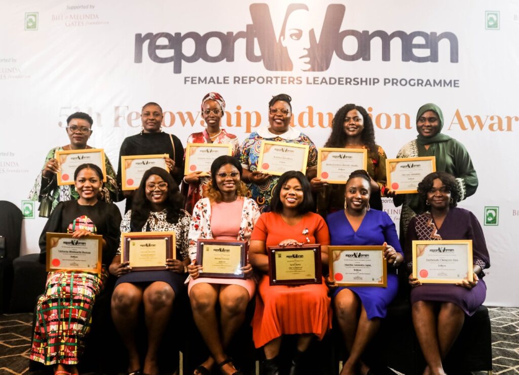 female reporters holding their awards