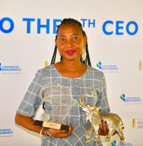 Nike Popoola holding her Pan African Reinsurance journalism award plaque at the event