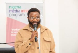 Muhammed Akinyemi shown speaking with a backdrop of Nigeria Media INovation Program banner